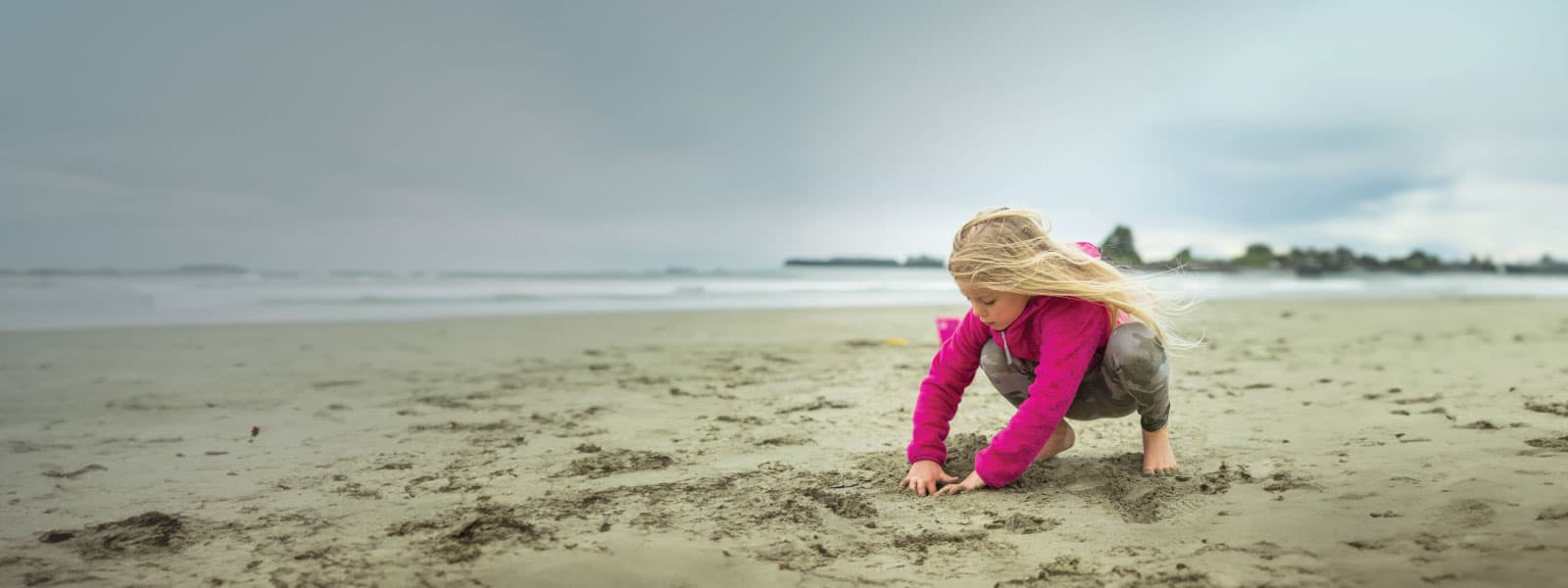 Child playing on a BC coastal beach